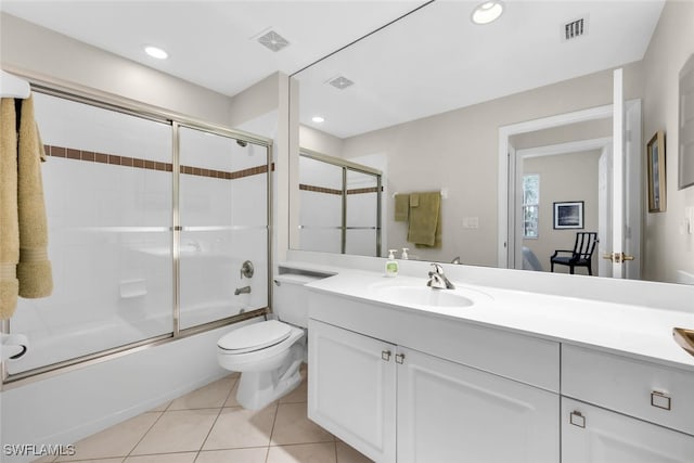 1630 Winding Oaks Way Unit 102, Naples, FL 34109 - full bathroom featuring vanity, combined bath / shower with glass door, toilet, tile patterned floors, and recessed lighting