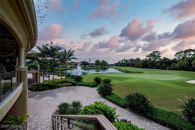 1630 Winding Oaks Way Unit 102, Naples, FL 34109 - surrounding community featuring a water view, golf course view, a putting area, and a yard