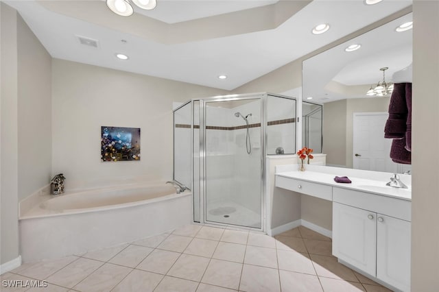 1630 Winding Oaks Way Unit 102, Naples, FL 34109 - full bath featuring a garden tub, tile patterned flooring, vanity, a raised ceiling, and a shower stall