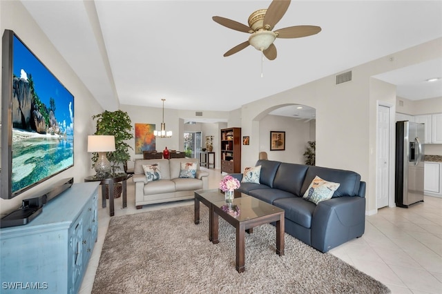 1630 Winding Oaks Way Unit 102, Naples, FL 34109 - living area with a ceiling fan, arched walkways, light tile patterned floors, and a chandelier