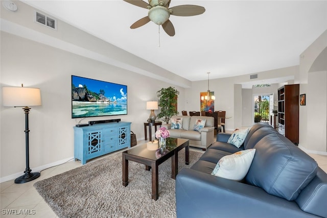 1630 Winding Oaks Way Unit 102, Naples, FL 34109 - living area with ceiling fan, a chandelier, light tile patterned floors, and baseboards