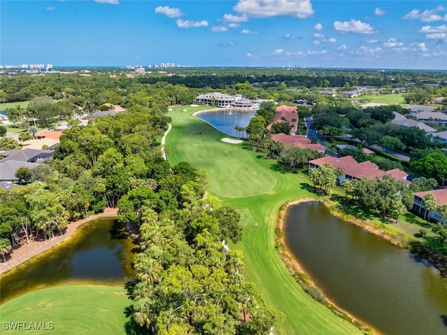 1630 Winding Oaks Way Unit 102, Naples, FL 34109 - aerial perspective of suburban area featuring a nearby body of water, a golf course, and a tree filled landscape