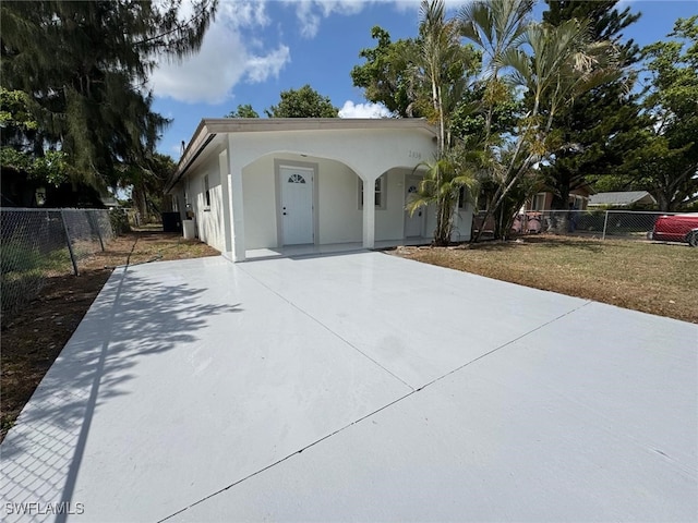 2938 Market St, Fort Myers, FL 33916 - mediterranean / spanish house with concrete driveway and stucco siding