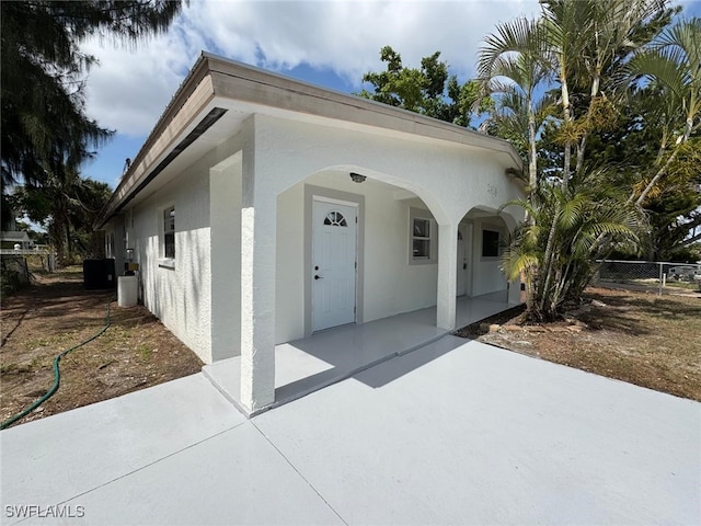 2938 Market St, Fort Myers, FL 33916 - view of front of property featuring stucco siding and central AC