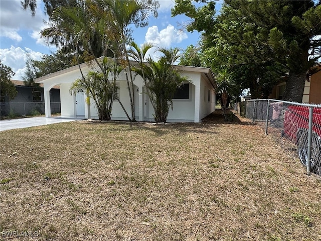 2938 Market St, Fort Myers, FL 33916 - view of front of house with stucco siding and concrete driveway