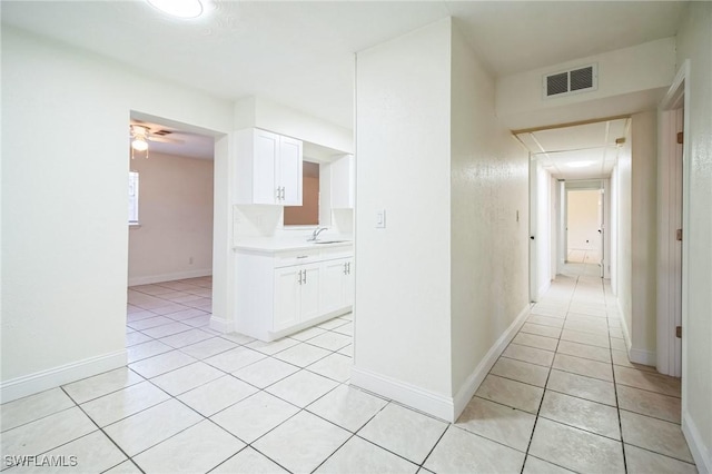 2938 Market St, Fort Myers, FL 33916 - corridor with a sink, light tile patterned floors, and baseboards