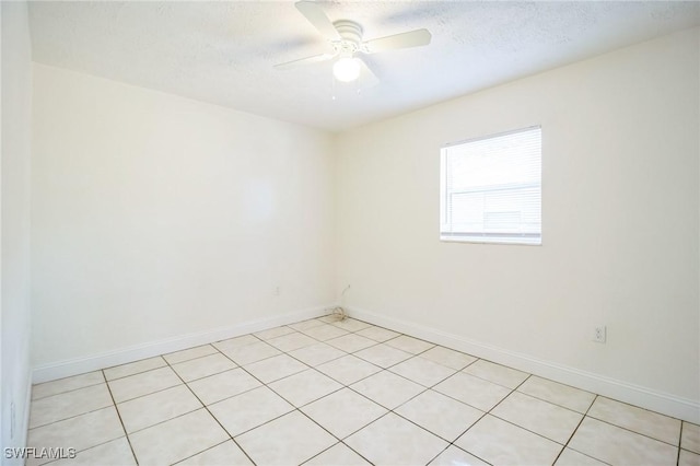 2938 Market St, Fort Myers, FL 33916 - unfurnished room with ceiling fan, baseboards, a textured ceiling, and light tile patterned floors