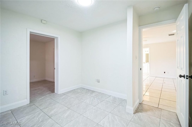 2938 Market St, Fort Myers, FL 33916 - spare room with light tile patterned floors, a smoke detector, and baseboards