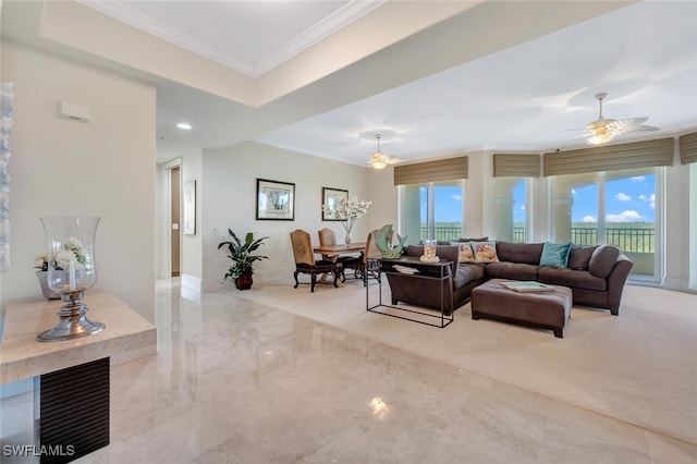 2738 Tiburon Blvd E Unit Ph-B502, Naples, FL 34109 - living room featuring ornamental molding, ceiling fan, light marble finish flooring, plenty of natural light, and baseboards