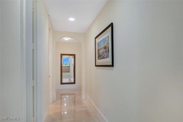2738 Tiburon Blvd E Unit Ph-B502, Naples, FL 34109 - hall featuring arched walkways and baseboards
