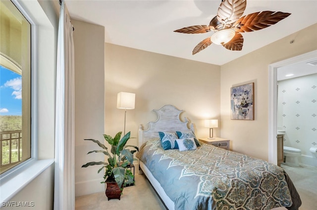 2738 Tiburon Blvd E Unit Ph-B502, Naples, FL 34109 - carpeted bedroom with connected bathroom and ceiling fan