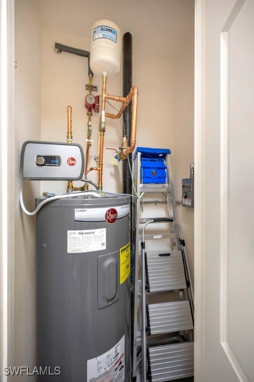 2738 Tiburon Blvd E Unit Ph-B502, Naples, FL 34109 - utility room featuring electric water heater