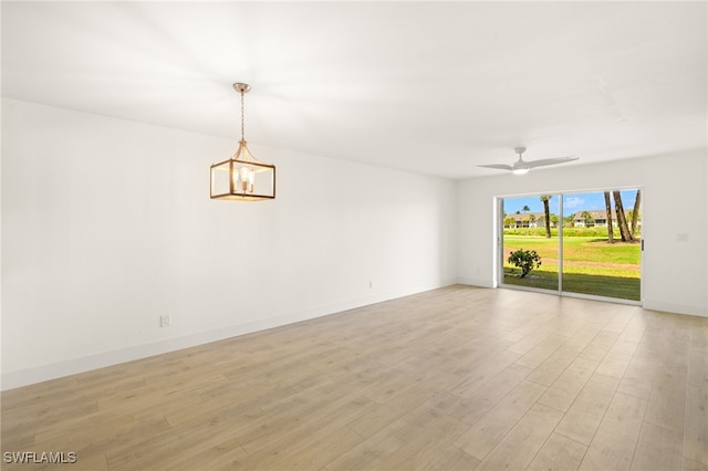 16320 Kelly Cove Dr Unit 270, Fort Myers, FL 33908 - empty room featuring light wood finished floors, a ceiling fan, and baseboards