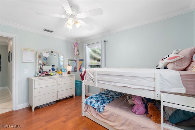 955 Hidden Terrace Rd, Naples, FL 34104 - bedroom featuring crown molding, wood finished floors, a ceiling fan, and baseboards