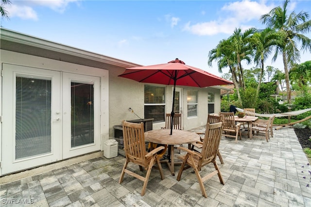 955 Hidden Terrace Rd, Naples, FL 34104 - view of patio / terrace featuring outdoor dining area and french doors