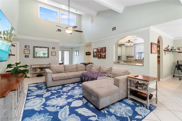 955 Hidden Terrace Rd, Naples, FL 34104 - living room with ceiling fan, arched walkways, high vaulted ceiling, light tile patterned flooring, and beam ceiling