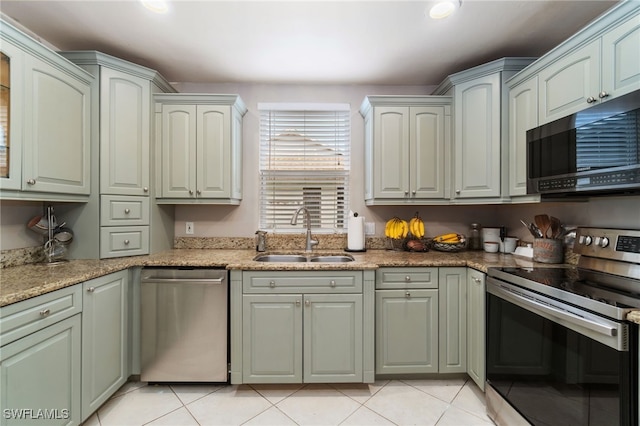 955 Hidden Terrace Rd, Naples, FL 34104 - kitchen with stainless steel appliances, a sink, light tile patterned floors, light stone countertops, and recessed lighting