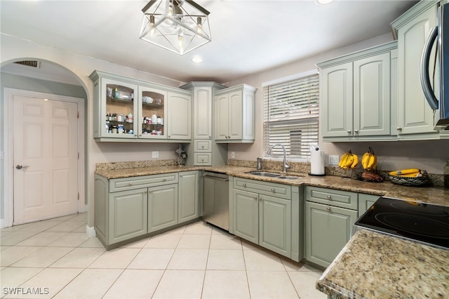 955 Hidden Terrace Rd, Naples, FL 34104 - kitchen with a sink, appliances with stainless steel finishes, light tile patterned floors, arched walkways, and recessed lighting