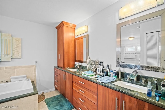 4226 Yarmouth Ct, North Fort Myers, FL 33903 - full bathroom with double vanity, tile patterned floors, and a bath