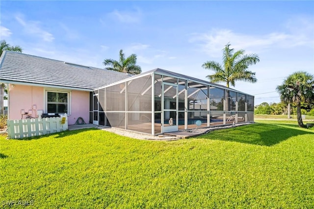 4226 Yarmouth Ct, North Fort Myers, FL 33903 - back of property featuring a yard, stucco siding, a patio area, a tile roof, and a pool