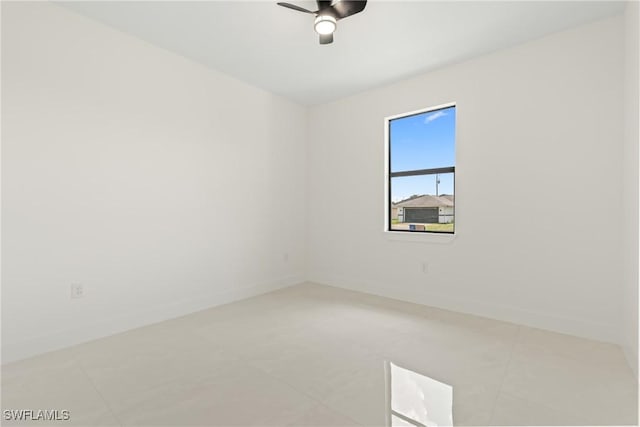 1015 Gerald Ave, Lehigh Acres, FL 33936 - unfurnished room with ceiling fan, baseboards, and light tile patterned floors