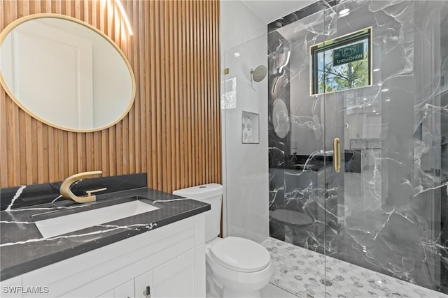 1015 Gerald Ave, Lehigh Acres, FL 33936 - bathroom featuring a marble finish shower, toilet, vanity, and wood walls