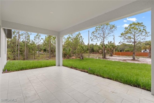 1015 Gerald Ave, Lehigh Acres, FL 33936 - view of patio / terrace with view of wooded area