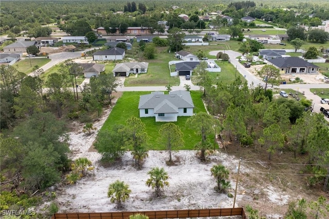 1015 Gerald Ave, Lehigh Acres, FL 33936 - aerial view of property and surrounding area featuring nearby suburban area