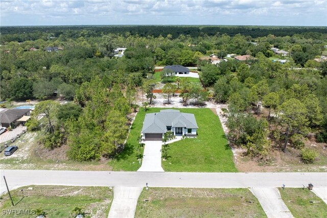 1015 Gerald Ave, Lehigh Acres, FL 33936 - drone / aerial view of a heavily wooded area
