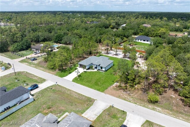 1015 Gerald Ave, Lehigh Acres, FL 33936 - bird's eye view of a heavily wooded area