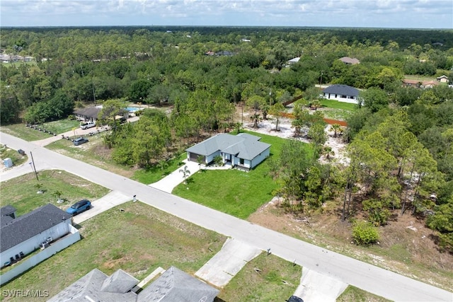 1015 Gerald Ave, Lehigh Acres, FL 33936 - bird's eye view of a heavily wooded area