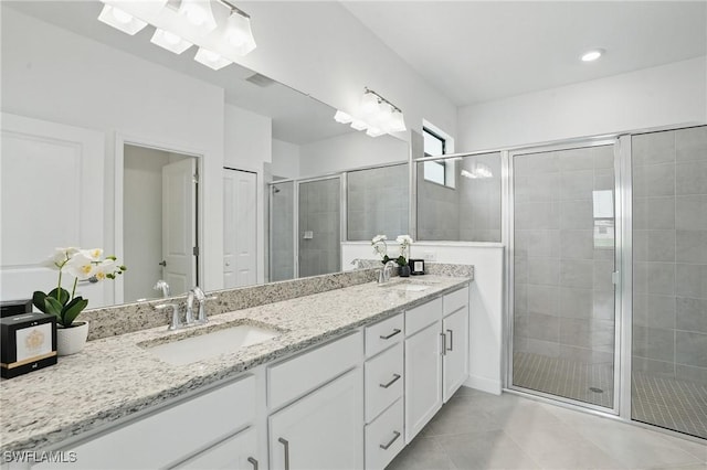 13952 Hunter Oak Dr, Fort Myers, FL 33913 - full bathroom with double vanity, a stall shower, and tile patterned flooring