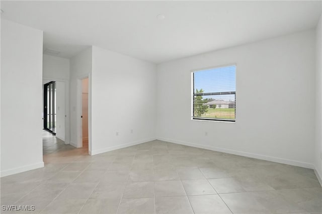 13952 Hunter Oak Dr, Fort Myers, FL 33913 - unfurnished room featuring light tile patterned floors and baseboards