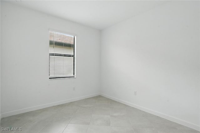 13952 Hunter Oak Dr, Fort Myers, FL 33913 - empty room featuring baseboards and light tile patterned floors