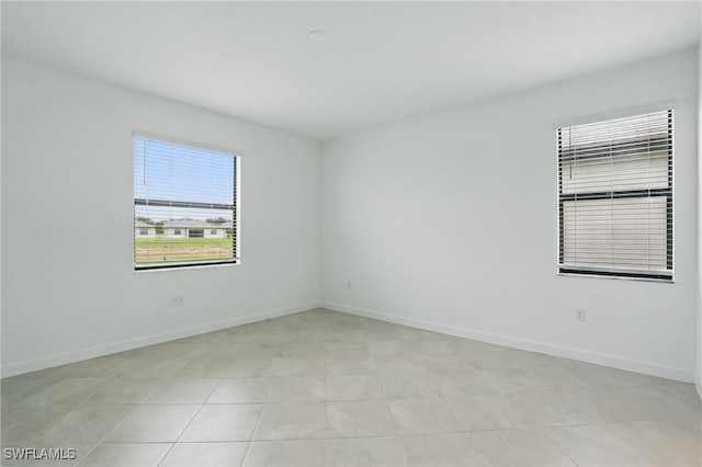 13952 Hunter Oak Dr, Fort Myers, FL 33913 - spare room featuring baseboards and light tile patterned floors