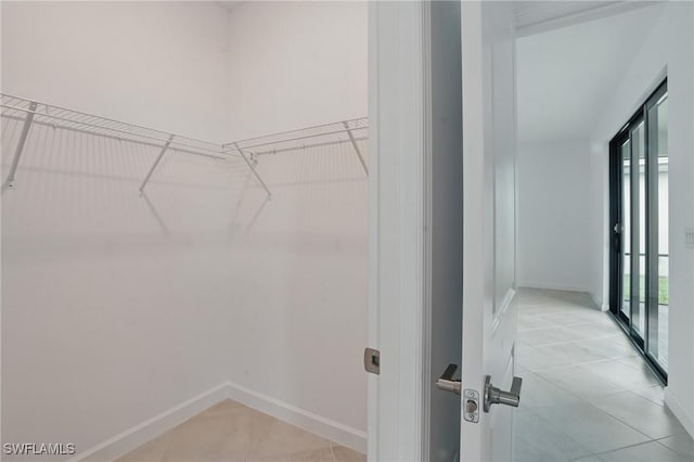 13952 Hunter Oak Dr, Fort Myers, FL 33913 - spacious closet featuring light tile patterned floors