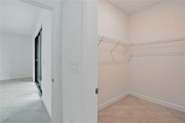 13952 Hunter Oak Dr, Fort Myers, FL 33913 - spacious closet with light tile patterned floors