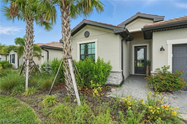 13952 Hunter Oak Dr, Fort Myers, FL 33913 - property entrance with stucco siding