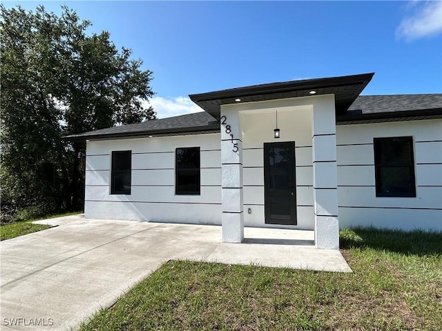 2815 4th St SW, Lehigh Acres, FL 33976 - view of front of property with roof with shingles