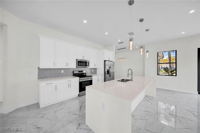 3034 Chiquita Blvd N, Cape Coral, FL 33993 - kitchen featuring appliances with stainless steel finishes, a sink, light marble finish flooring, tasteful backsplash, and white cabinets