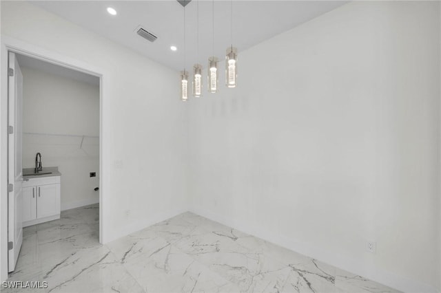 3034 Chiquita Blvd N, Cape Coral, FL 33993 - unfurnished dining area featuring a sink, baseboards, light marble finish flooring, and recessed lighting