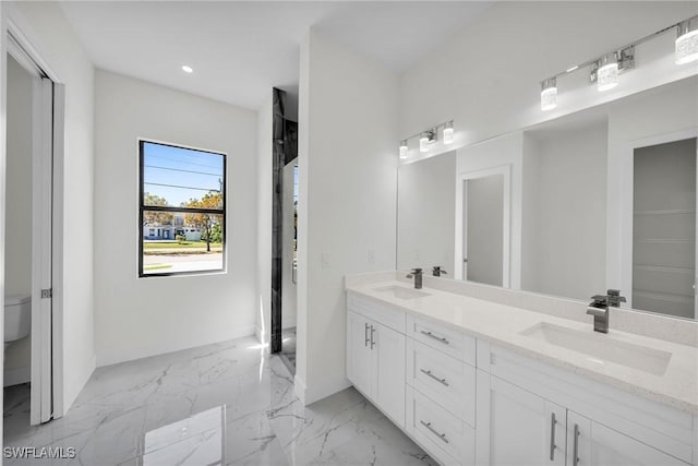 3034 Chiquita Blvd N, Cape Coral, FL 33993 - bathroom featuring double vanity, toilet, recessed lighting, and marble finish floors