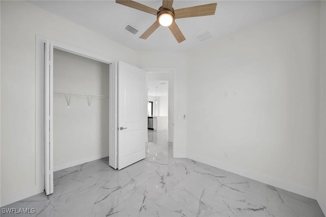 3034 Chiquita Blvd N, Cape Coral, FL 33993 - unfurnished bedroom featuring baseboards, marble finish floors, a closet, and ceiling fan