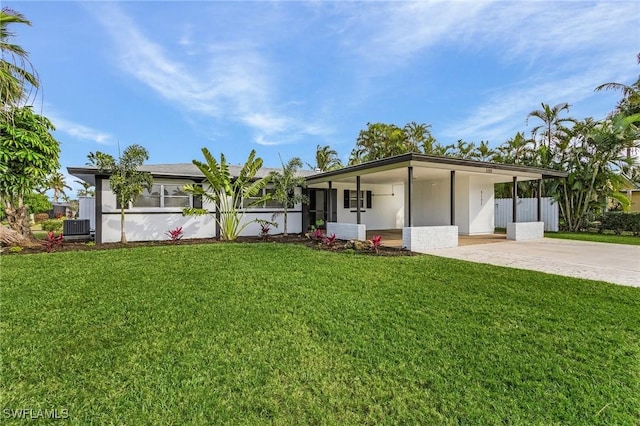 5127 SW 3rd Ave, Cape Coral, FL 33914 - view of front of home featuring driveway, a front lawn, and central AC