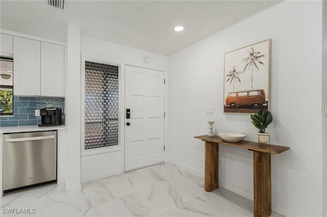 5127 SW 3rd Ave, Cape Coral, FL 33914 - entryway with light marble finish floors, baseboards, and recessed lighting