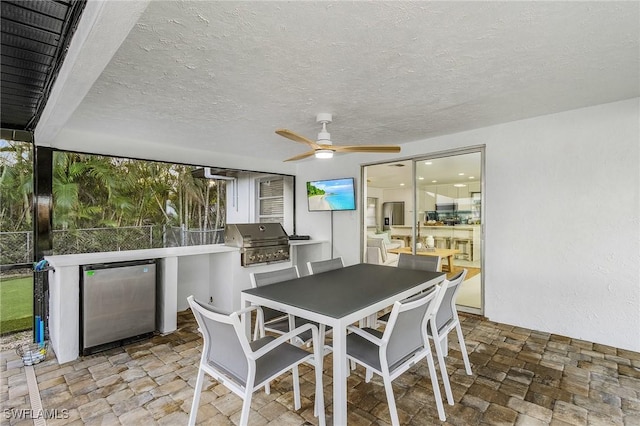 5127 SW 3rd Ave, Cape Coral, FL 33914 - dining space with a ceiling fan, stone finish flooring, and a textured ceiling