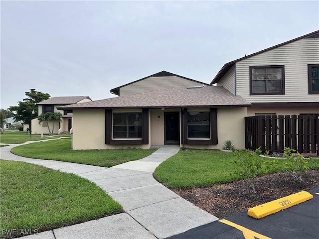 632 SE 12th Ct Unit 12, Cape Coral, FL 33990 - view of front of property featuring roof with shingles and stucco siding