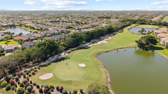 4654 Kensington Cir, Naples, FL 34119 - aerial view of property and surrounding area with nearby suburban area, a local golf course, and a large body of water