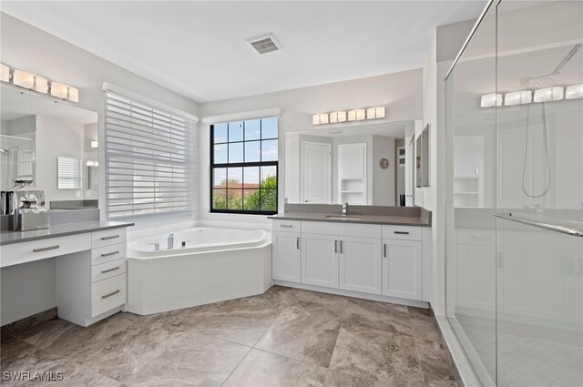 4654 Kensington Cir, Naples, FL 34119 - full bath featuring vanity, a stall shower, and a bath