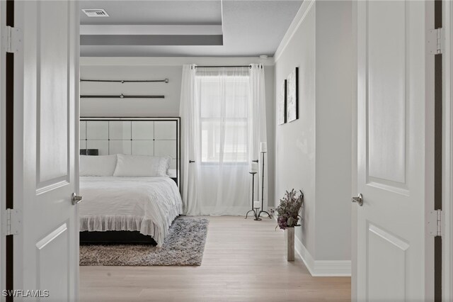 4654 Kensington Cir, Naples, FL 34119 - bedroom with light wood finished floors and baseboards